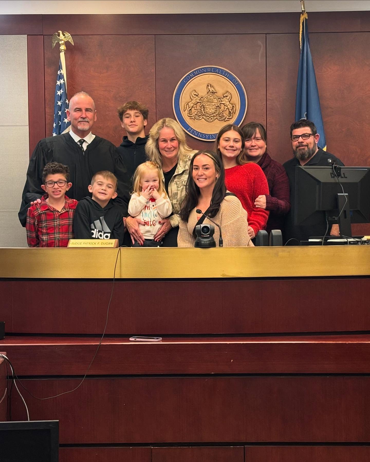 Pat with family on bench.jpg